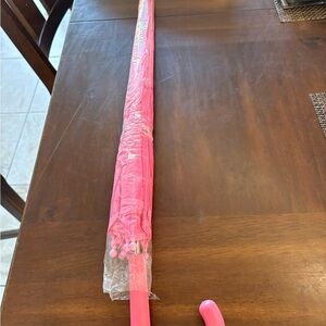 PINK UMBRELLA WITH PINK HEARTS MEASURES 29” LONG  STRAIGHT DOWN CURVE HANDLE